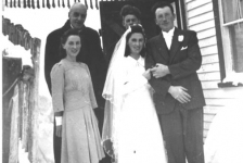 076: l-r back, Fr. Fyme, Alec Ryan; front, maid of honour Theresa Ryan, Anne Ryan, and Anne's husband  Alfred Grant, standing by the Ryan house. (1943) [courtesy of Mollie McCarthy]  - Alec is the son of Michael Ryan &amp;amp; Petronella Whelan; Marie and Anne are the daughters of  Joseph Ryan &amp;amp; Ursula Barry
2024-03-24 Correction submitted by Gary M. Grant, 4th son of Alfred &amp;amp; Annie, properly identifying Theresa, not Marie, as the maid of honour.
